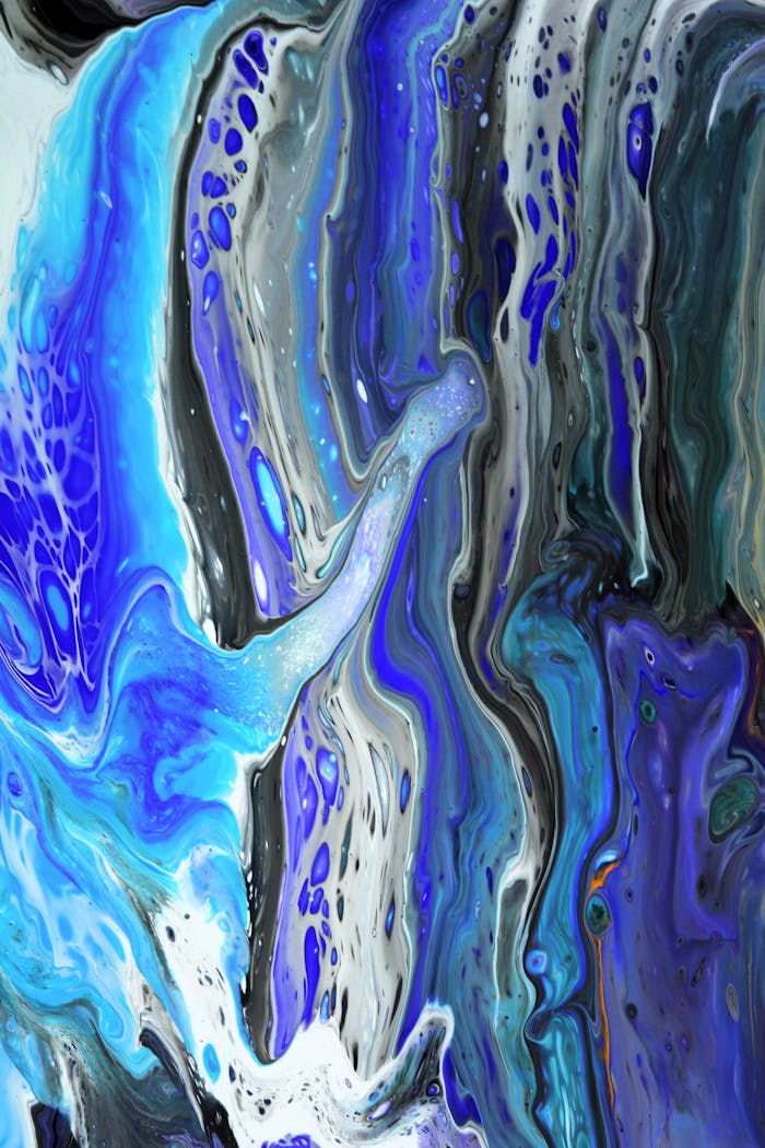 Mastering the First Impression: Your intriguing post title goes here Colorful abstract acrylic pour painting with blue, white, and gray swirls.